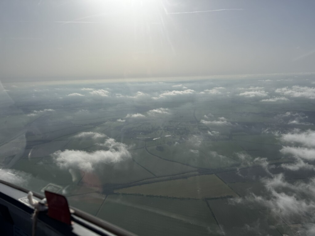 An unidentified village under some fluffy clouds